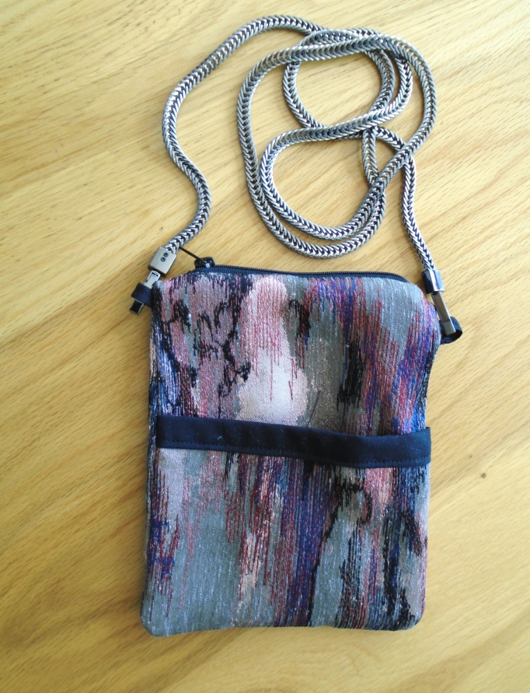 Multi coloured and pink phone pouch image